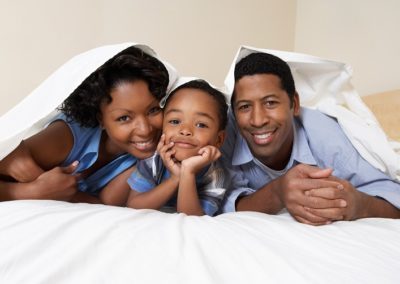 African American Family on Bed
